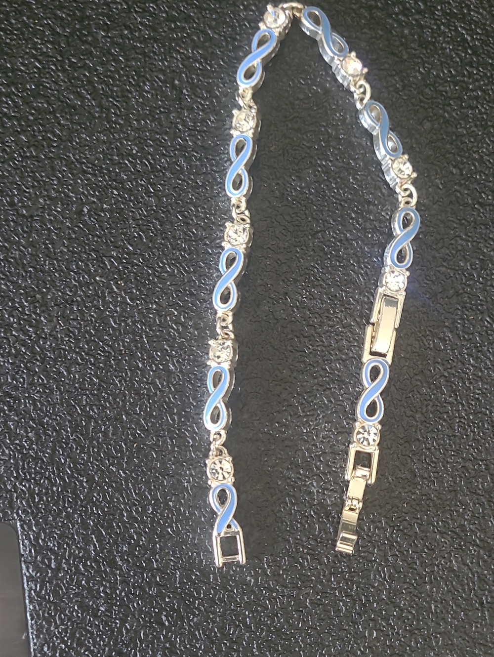 Avon Silver Tone Bracelet with Light Blue Enamel Infinity Links